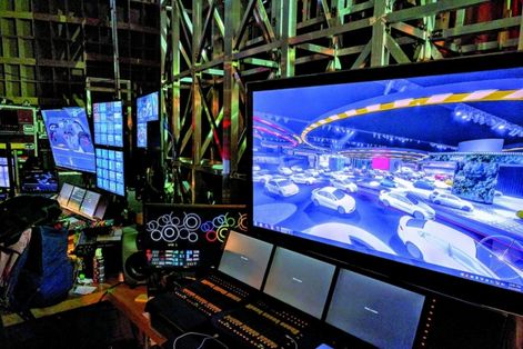 Auto show’s elaborate display builders have more in mind than entertainment